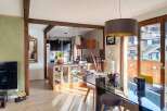 Discover this charming open-concept living space, seamlessly blending a modern kitchen with a dining area perfect for entertaining.