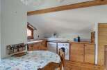 Discover this charming kitchen and dining area, perfect for cozy meals.