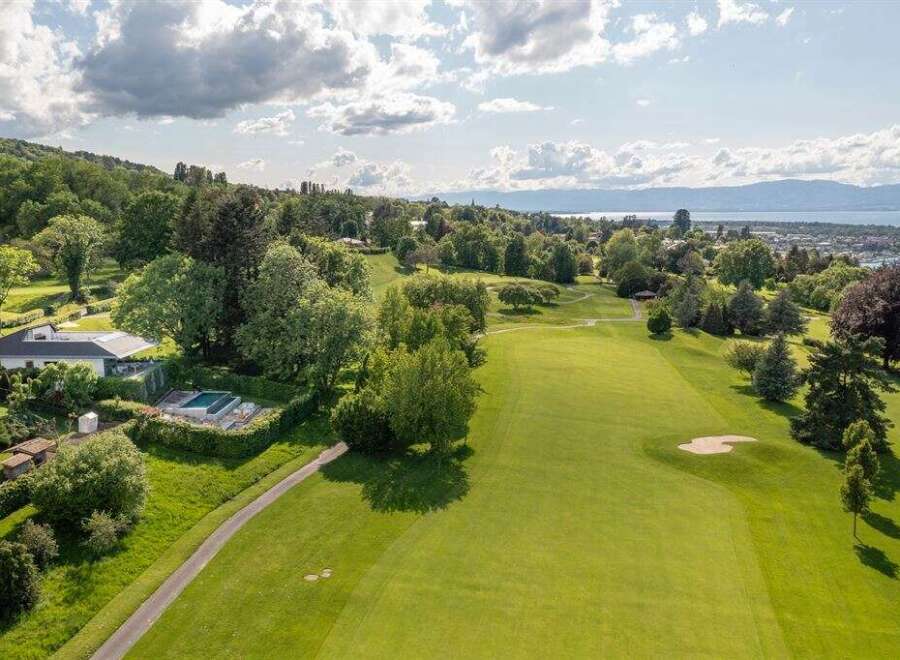 Experience luxury living with this stunning property featuring a private swimming pool and expansive golf course views.