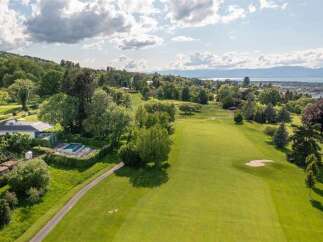 Experience luxury living with this stunning property featuring a private swimming pool and expansive golf course views.