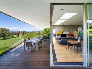 Experience luxurious indoor-outdoor living with this stunning modern home featuring a spacious deck overlooking a picturesque golf course.