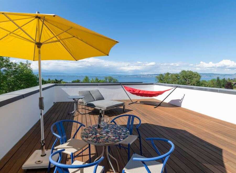 Enjoy breathtaking lake views from this stunning rooftop terrace, perfect for relaxation and entertaining.