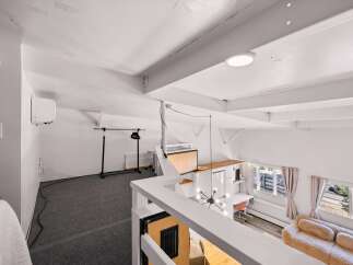 Discover this versatile loft space, perfect for a home office or creative studio.
