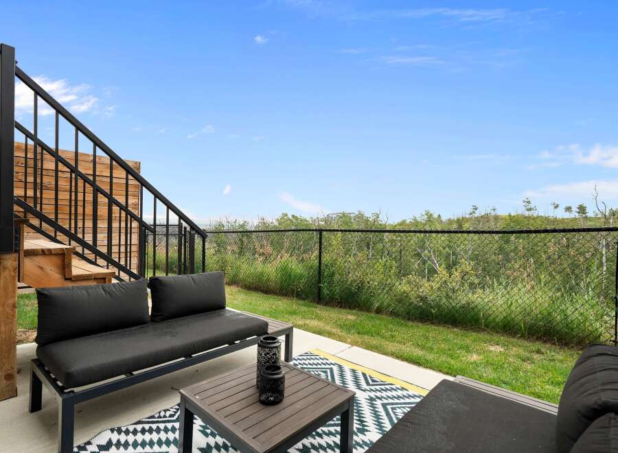 Enjoy outdoor living on this spacious patio, perfect for relaxing or entertaining.