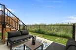 Enjoy outdoor living on this spacious patio, perfect for relaxing or entertaining.