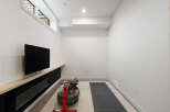 Transform this versatile space into your personal home gym, complete with a rowing machine and yoga mat.