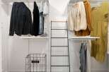 Discover organized living with this spacious walk-in closet, featuring ample shelving and hanging space for all your apparel.