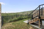 Enjoy the stunning natural views from this property's elevated deck, perfect for outdoor entertaining.