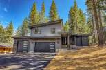 Discover modern mountain living in this stunning contemporary home nestled among tall pine trees.