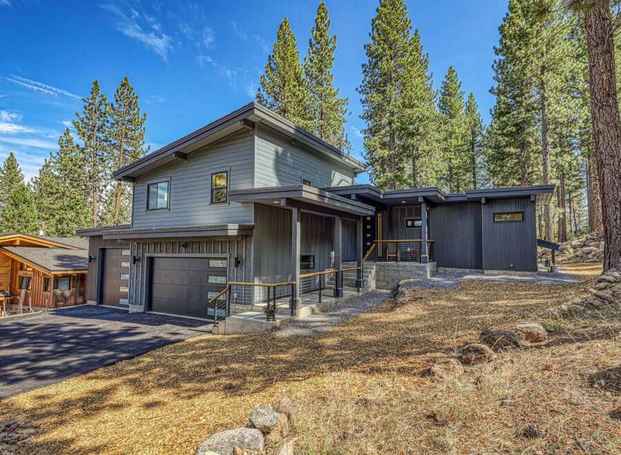 Experience modern mountain living in this stunning contemporary home, nestled amongst towering pine trees.