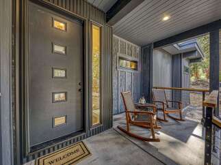 Welcome guests to your modern mountain retreat with this inviting entryway.