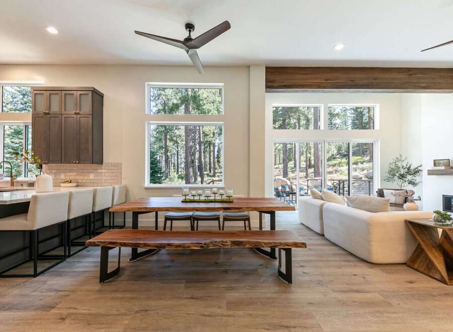 Experience modern living in this open-concept home, featuring a gourmet kitchen with a breakfast bar and a spacious dining area perfect for entertaining.