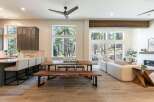 Experience modern living in this open-concept home, featuring a gourmet kitchen with a breakfast bar and a spacious dining area perfect for entertaining.