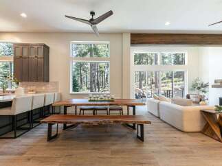 Experience modern living in this open-concept home, featuring a gourmet kitchen with a breakfast bar and a spacious dining area perfect for entertaining.