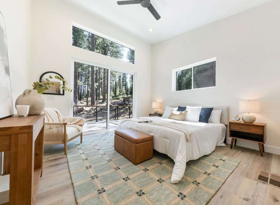 Experience modern living surrounded by nature in this stunning bedroom.