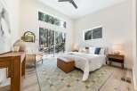 Experience modern living surrounded by nature in this stunning bedroom.
