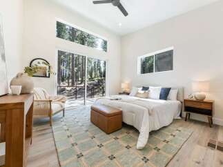 Experience modern living surrounded by nature in this stunning bedroom.