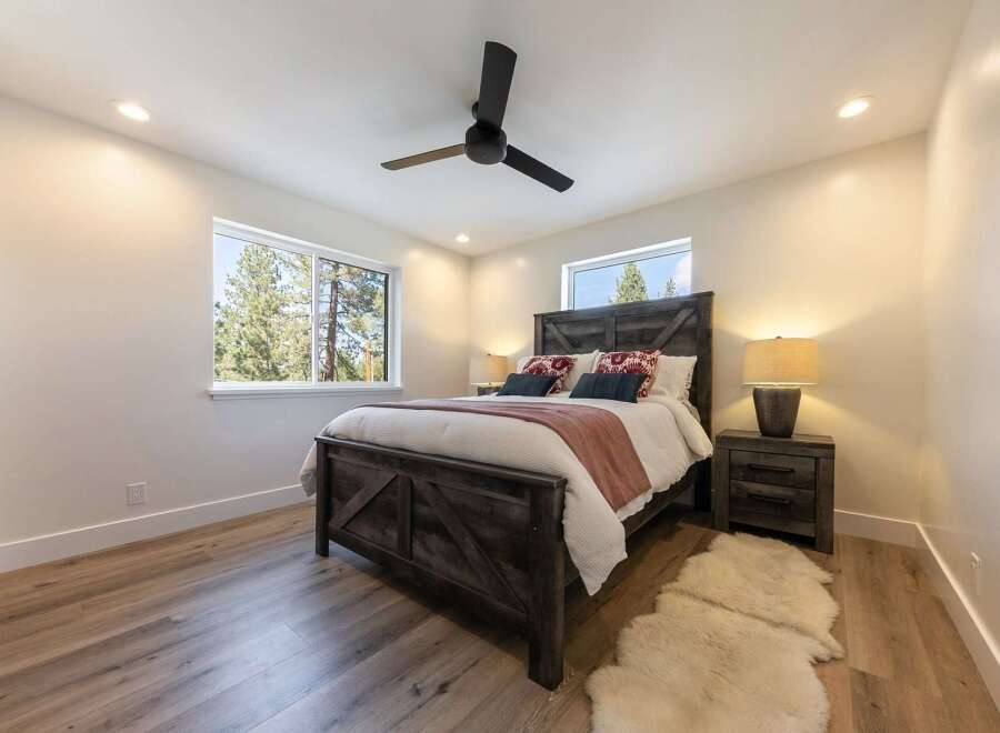 Experience rustic charm and modern comfort in this inviting bedroom.