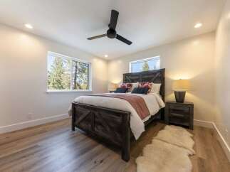 Experience rustic charm and modern comfort in this inviting bedroom.