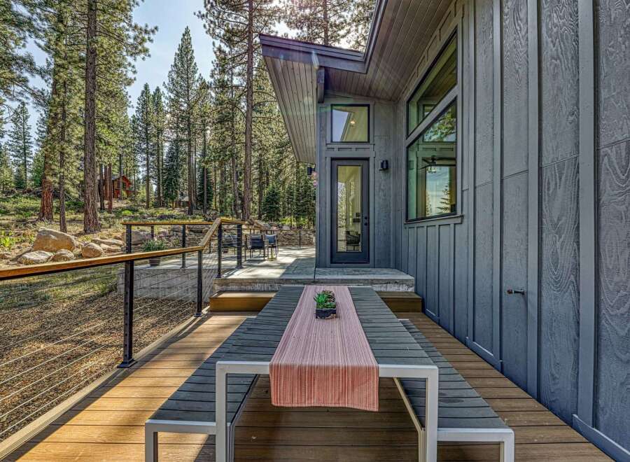 Experience modern mountain living with this stunning property featuring a spacious deck perfect for outdoor entertaining.
