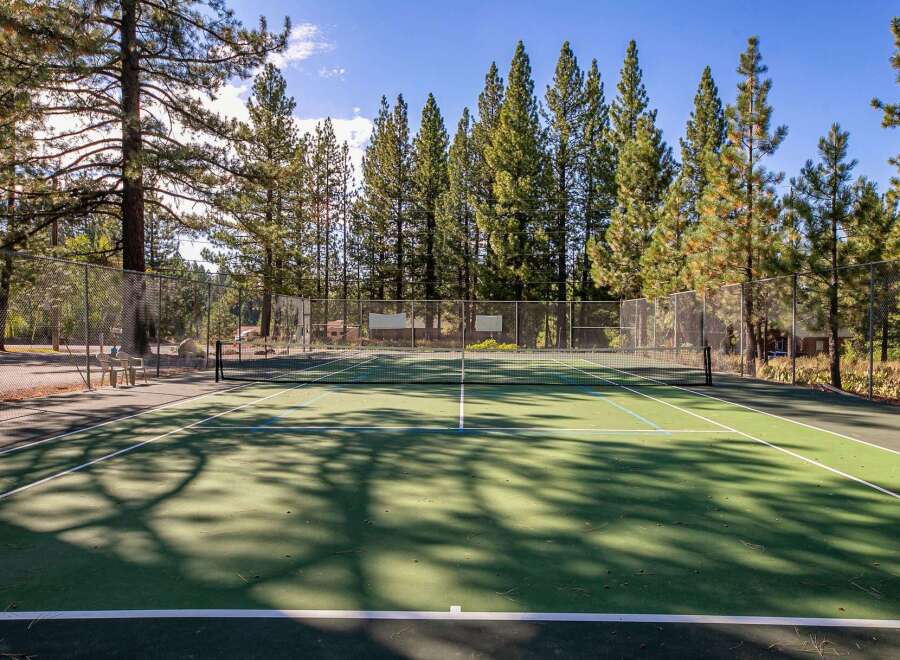 Enjoy an active lifestyle with this fantastic tennis court, perfect for residents of this property.