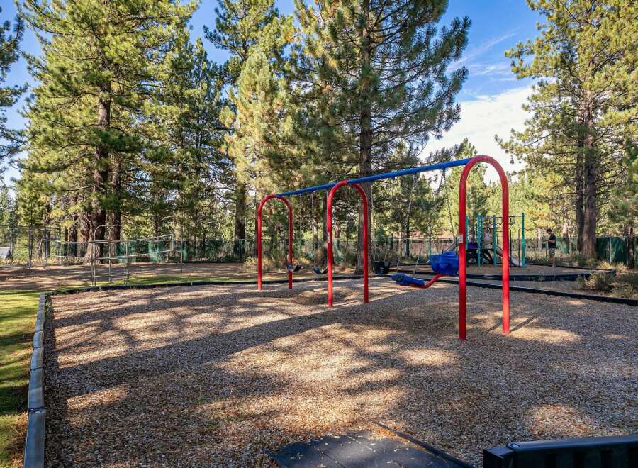 Enjoy outdoor fun at this property's dedicated playground, featuring swings and climbing structures perfect for children.