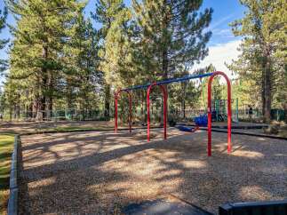 Enjoy outdoor fun at this property's dedicated playground, featuring swings and climbing structures perfect for children.