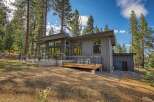 Experience modern mountain living in this stunning contemporary home nestled amongst tall pine trees.