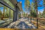 Experience modern living with this stunning home featuring expansive floor-to-ceiling windows that seamlessly blend indoor and outdoor spaces.