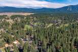 Nestled amidst a dense forest of tall pine trees, this property offers a serene and private retreat.