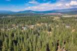 Nestled amidst a dense forest of mature pine trees, this property offers a serene and private retreat.