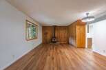 Step into this charming living space featuring a cozy wood-burning stove, perfect for chilly evenings.