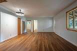 Step into this spacious living area featuring beautiful wood-look flooring that extends throughout the home.