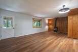 Step into this charming living space featuring a cozy wood-burning stove, perfect for chilly evenings.
