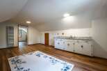 Discover this charming attic space, perfect for a home office or guest suite.