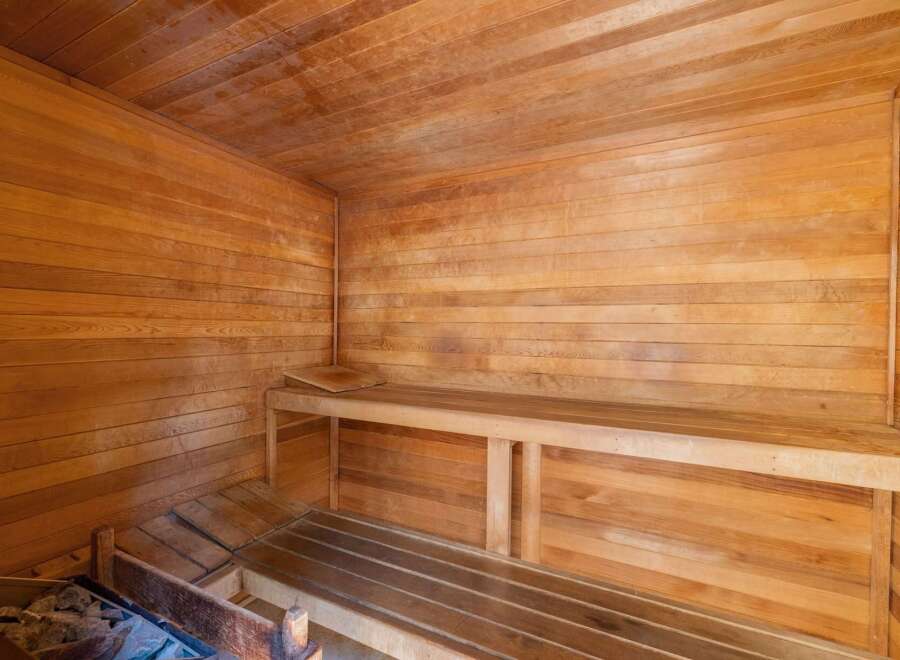 Experience ultimate relaxation in this beautifully crafted wooden sauna.