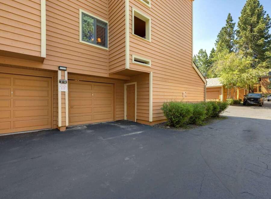 Discover this charming property featuring a warm, inviting exterior with rich orange siding and complementary trim.