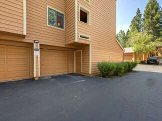 Discover this charming property featuring a warm, inviting exterior with rich orange siding and complementary trim.