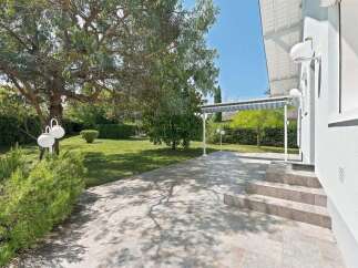Enjoy outdoor living with this spacious patio, perfect for entertaining or relaxing.