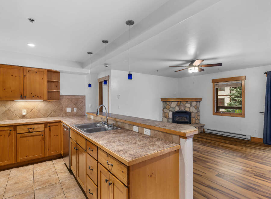 Discover this charming kitchen and living area, perfect for cozy gatherings.