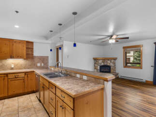 Discover this charming kitchen and living area, perfect for cozy gatherings.
