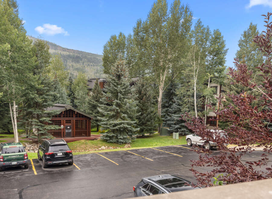 Nestled amidst lush greenery and mature trees, this property offers a serene mountain retreat.
