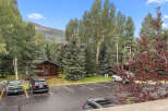 Nestled amidst lush greenery and mature trees, this property offers a serene mountain retreat.