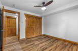 Step into this inviting room featuring a warm wooden interior and a stylish ceiling fan.
