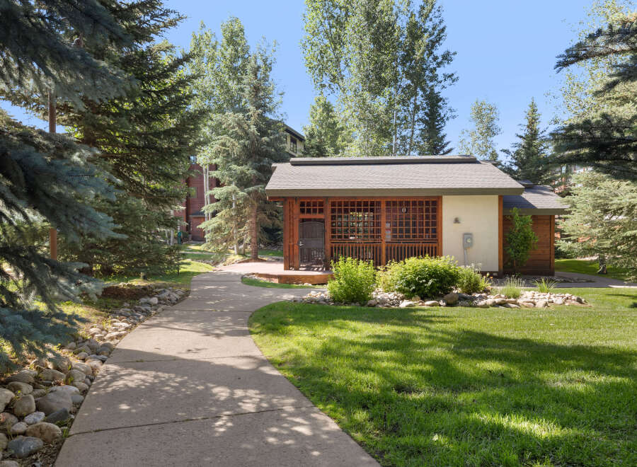 Discover this charming property featuring a beautifully crafted wooden structure with a covered porch, perfect for enjoying the outdoors.
