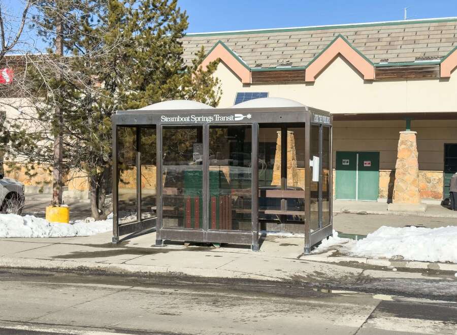 Discover convenient transit options with this Steamboat Springs Transit bus stop, featuring a sheltered waiting area and clear signage.