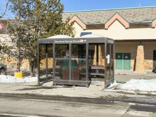 Discover convenient transit options with this Steamboat Springs Transit bus stop, featuring a sheltered waiting area and clear signage.