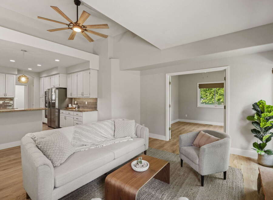 Experience modern living in this beautifully appointed open-concept home, featuring a sleek kitchen with stainless steel appliances and ample cabinet space.