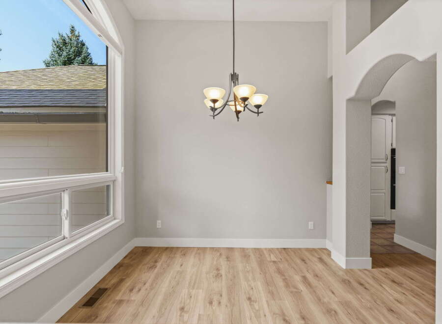 Experience spacious living in this bright dining area, featuring a large bay window that floods the room with natural light.