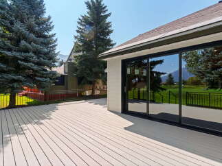 Step outside onto a spacious, modern deck perfect for entertaining or relaxing with stunning mountain views.